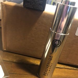 OPEN bottle of MONAT Rejuveniqe oil intensive